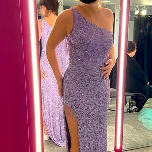 Beautiful one shoulder, sparkly gem covered with beading detail at leg.